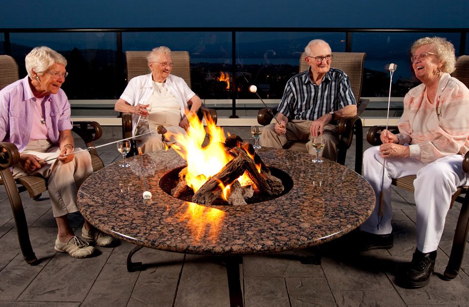 Campfire Table surrounded by seniors 